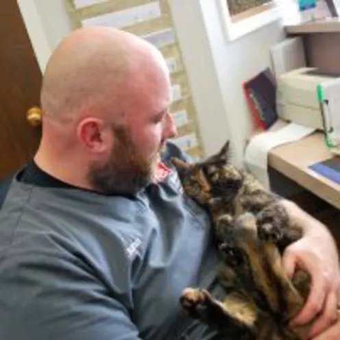 Animal Care Center of Polaris staff holding cat